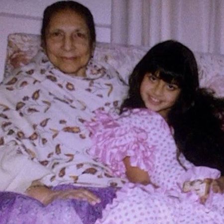 A young Jameela Jamil posing for a picture alongside her great grandmother